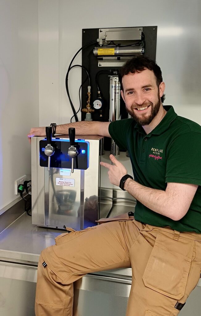 EcoPure Waters engineer with newly installed system